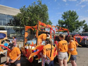 Prairie Band Team Members decorating float at Fiesta Topeka 2024